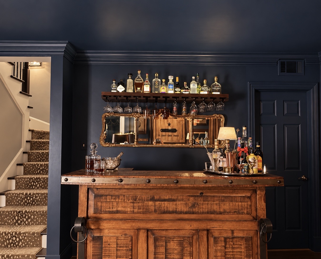 Antique wood bar against a deep navy wall