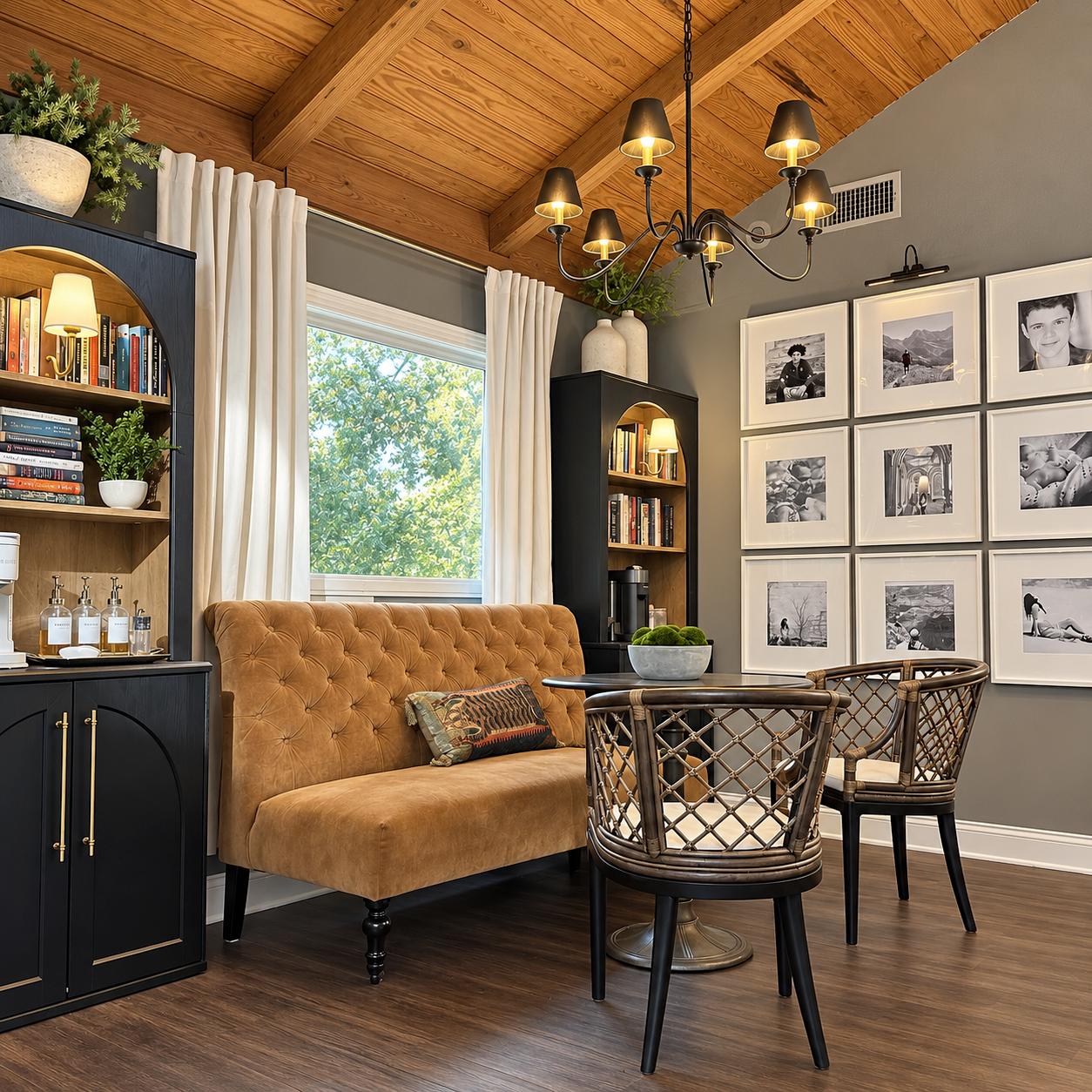 Dining nook with caramel banquette, art wall, and built-in shelving